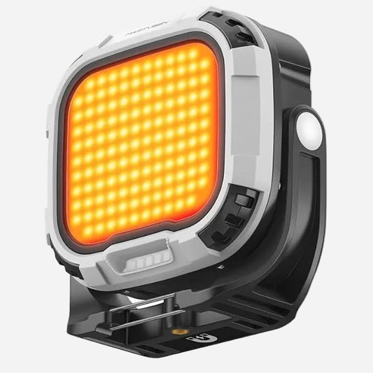 LED work light with orange panel on a white background